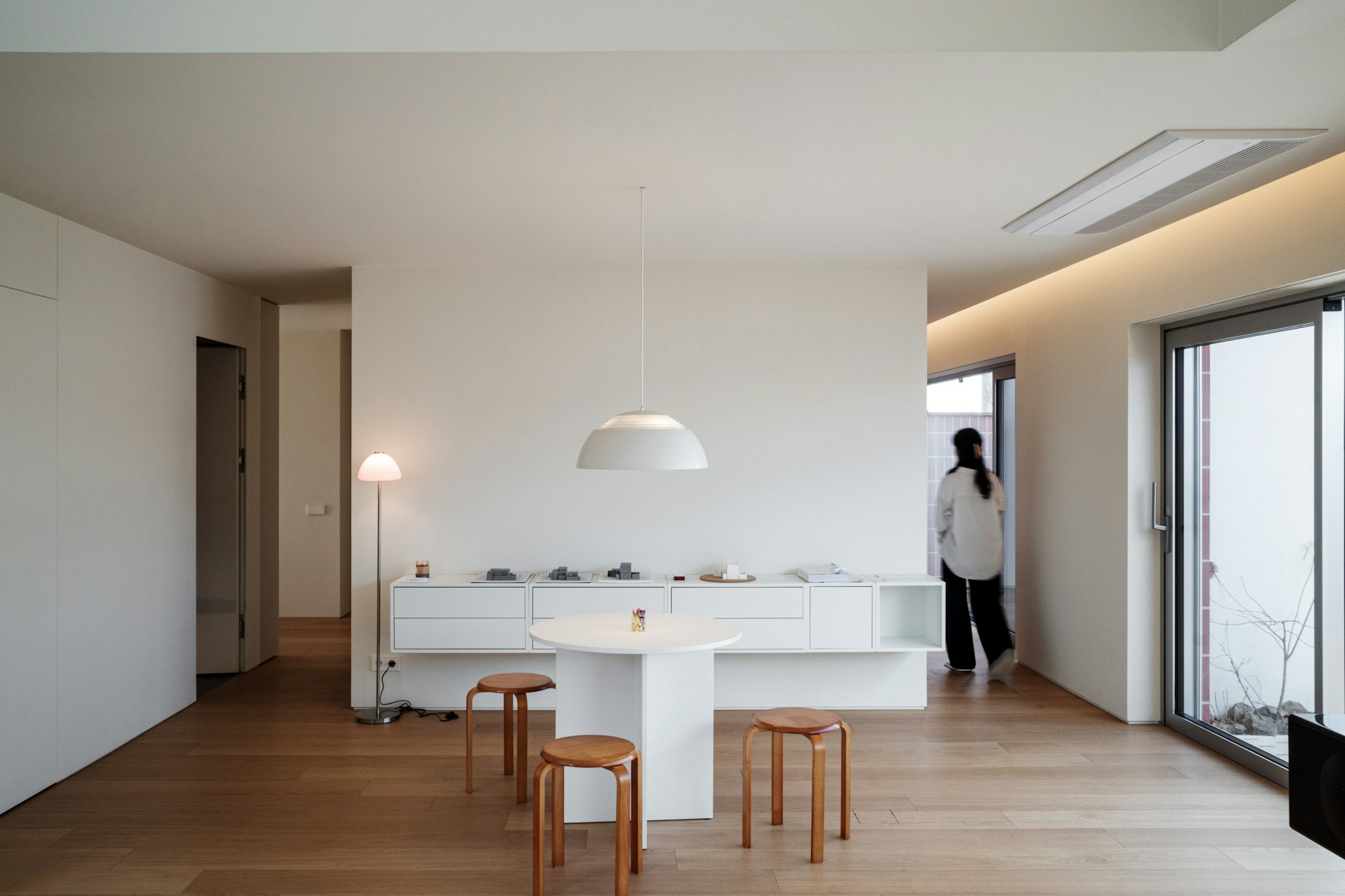 Minimal contemporary interior with clean white walls and ceiling