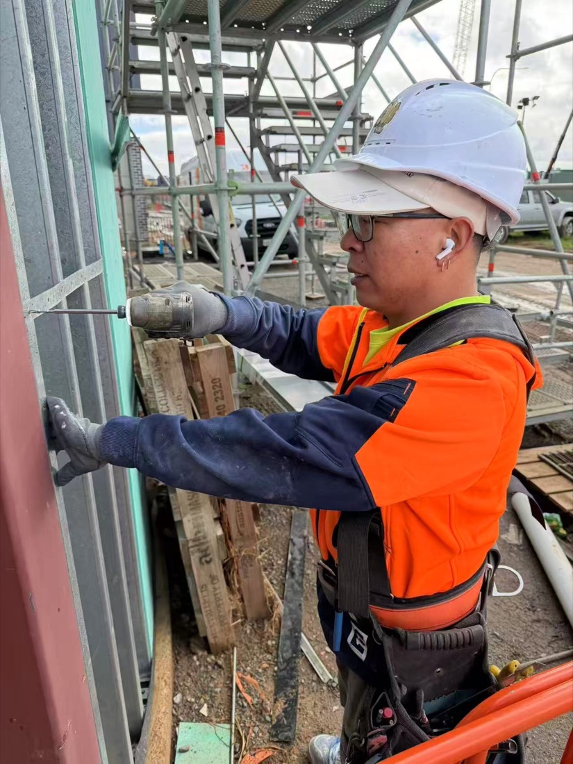 EM PROJECT team member fixing boards